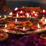 Row of lit festival diyas