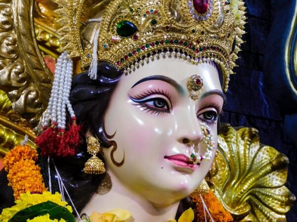 Gold and white Hindu deity figurine