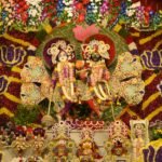 Radha Krishna idols with flowers