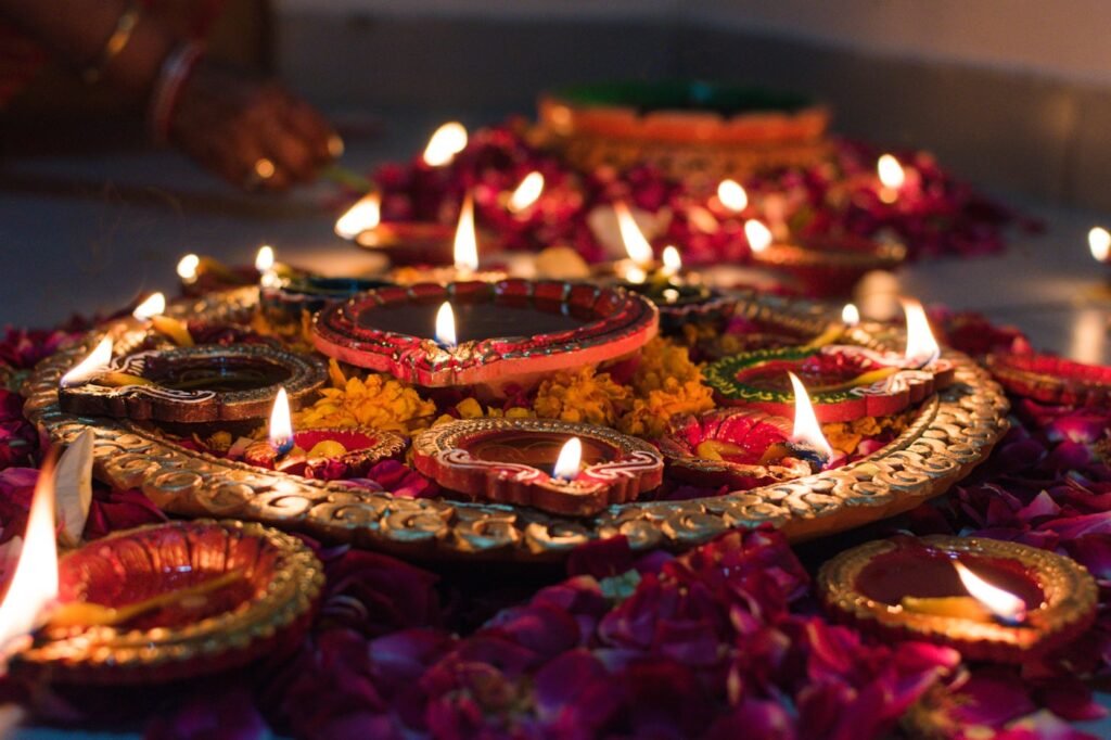 Row of lit festival diyas