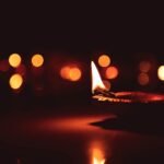 Lit diya lamp bokeh glow