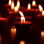 Decorative diya candles on wooden surface
